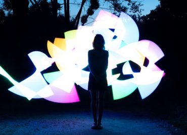 woman-with-colorful-lights-full-shot_23-2149679101